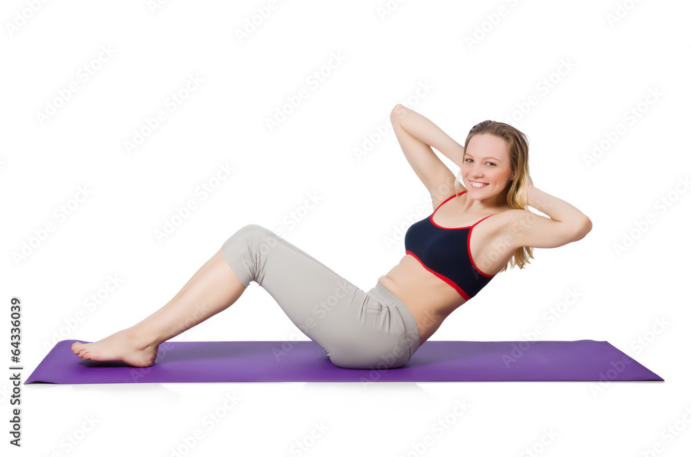 Young female doing exercises on white Young female doing exercises on white