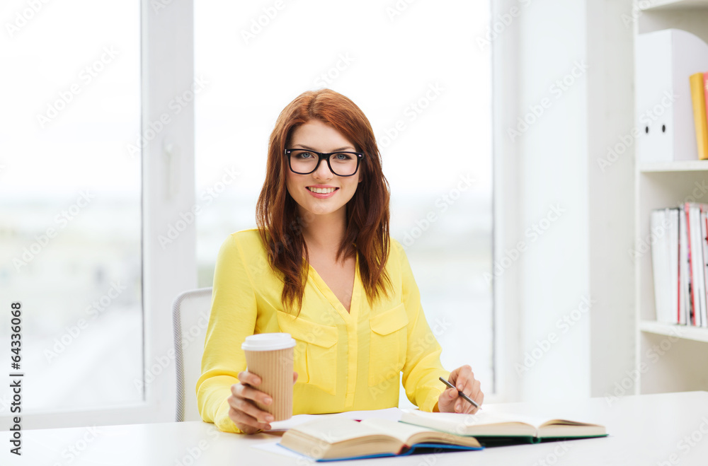 smiling student girl reading books in library smiling student girl reading books in library