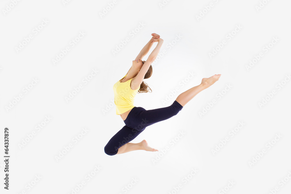 girl jumping dancing isolated on a white studio background