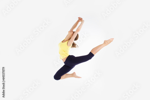 girl jumping dancing isolated on a white studio background