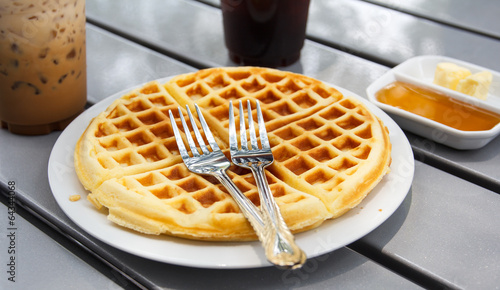 fresh waffle  in white plate on the table