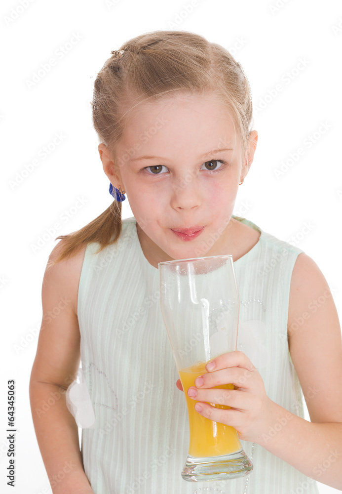 Cute little girl drinks orange juice Cute little girl drinks orange juice