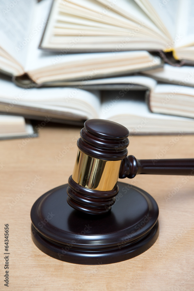 wooden gavel and books