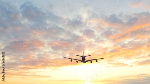 Airplane take off in the sunset