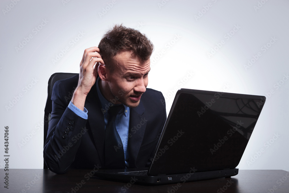 business man reads on his laptop business man reads on his laptop