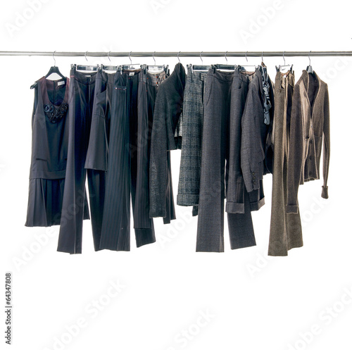 Set of female dress and trousers isolated on hanging