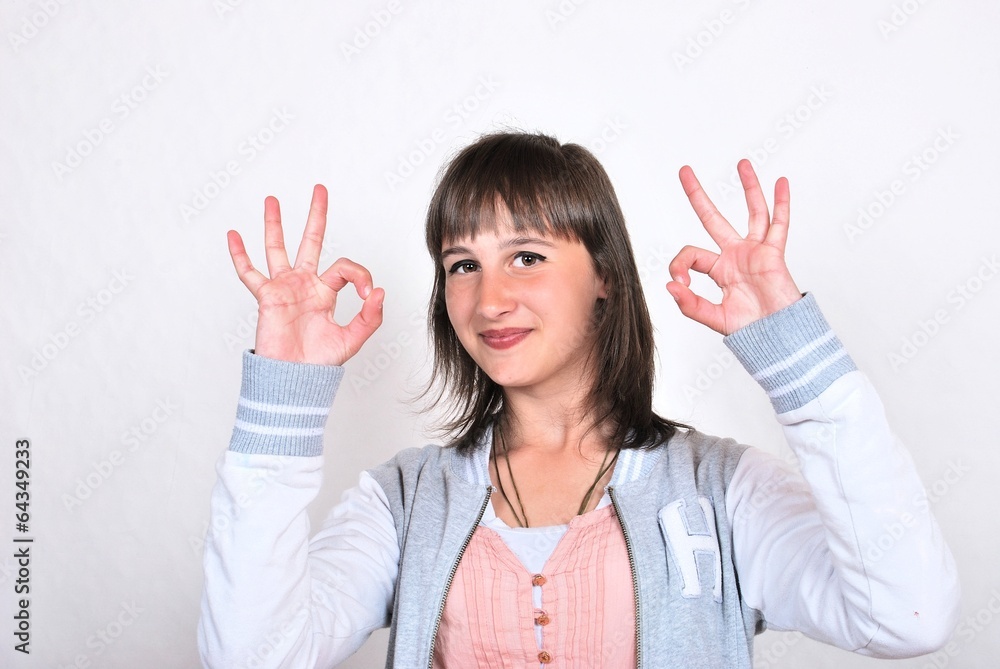 Girl giving OK sign Girl giving OK sign