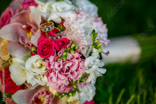 Wedding rings on a roses flowers  focused to the rings