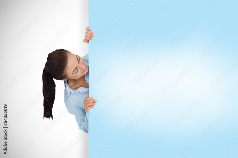 Composite image of businesswoman showing card Composite image of businesswoman showing card