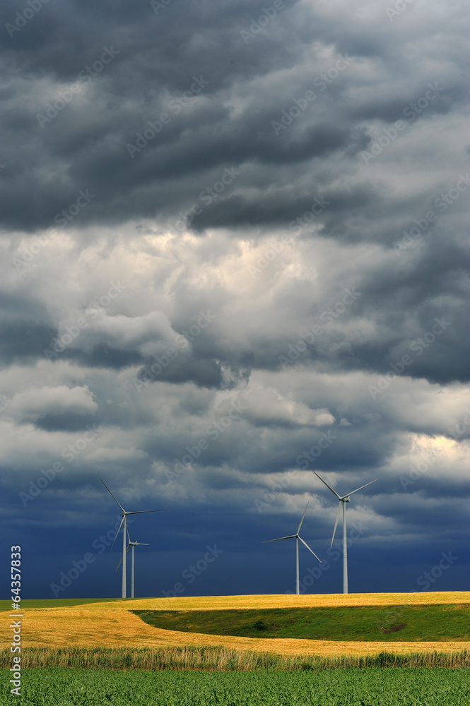 Dark rain clouds on wind power installations.