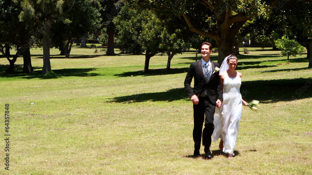 Excited newlyweds running towards the camera Excited newlyweds running towards the camera