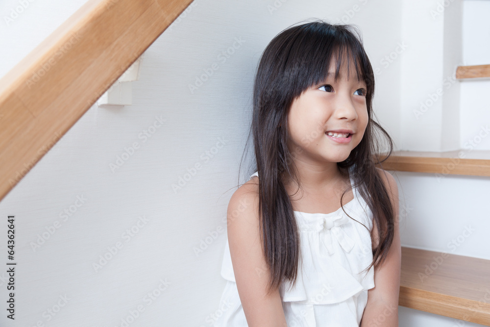 Girl sitting in on the ladder Girl sitting in on the ladder
