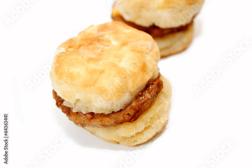 Close-Up of a Hot Sausage Sandwich with Biscuits