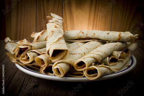 Sweet crepes with chocolate cream homemade product photo