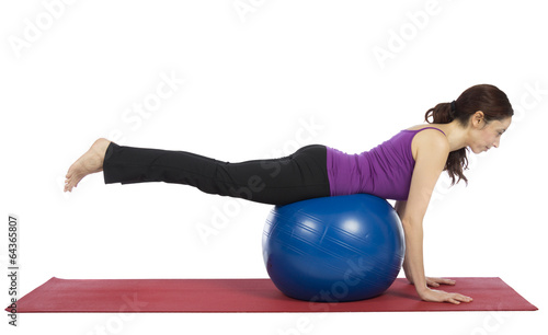 Woman balancing on pilates ball