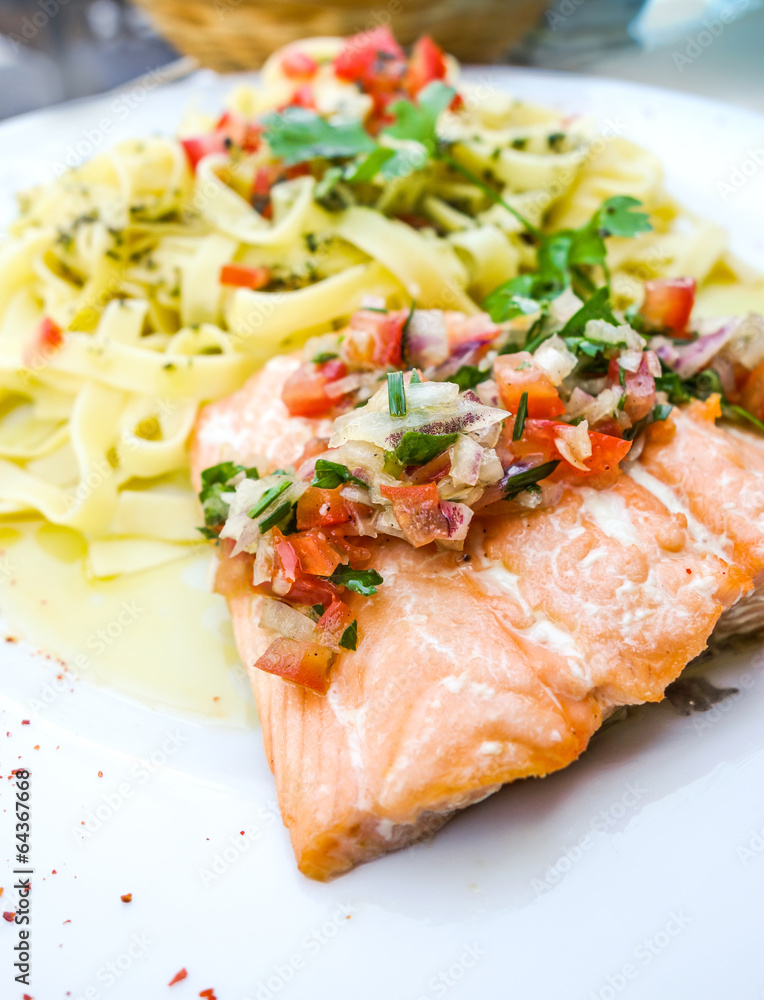 plate of pasta and smoked salmon with tomato
