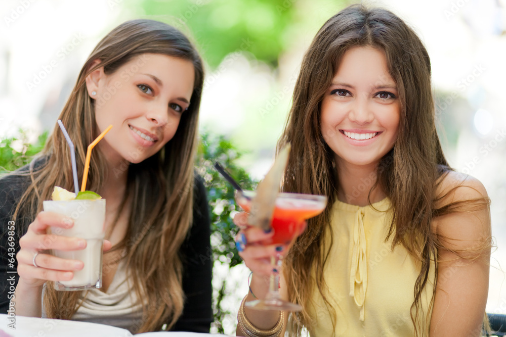 Two girls having an aperitif outdoor Two girls having an aperitif outdoor