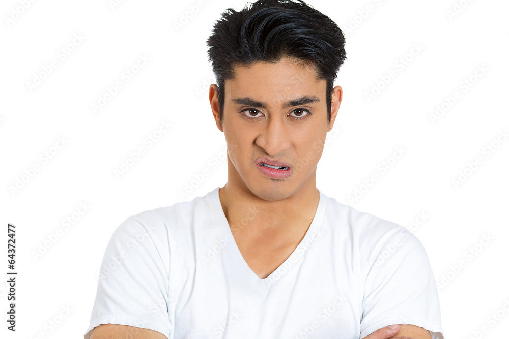 Portrait of pissed off angry, upset young man white background Portrait of pissed off angry, upset young man white background