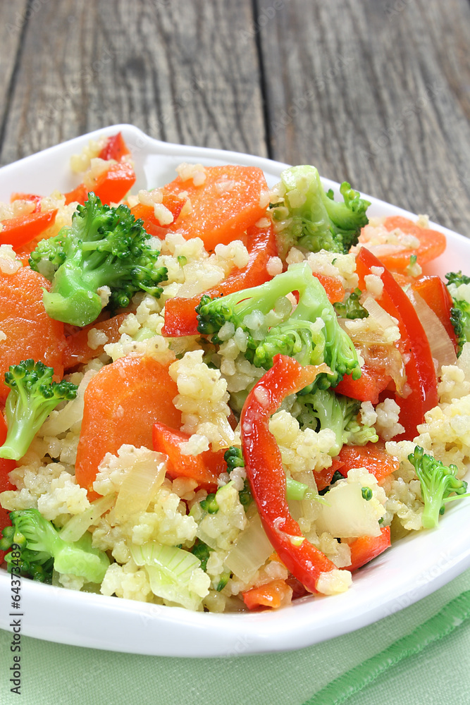 Millet fried with carrots, broccoli, paprika and onion Millet fried with carrots, broccoli, paprika and onion