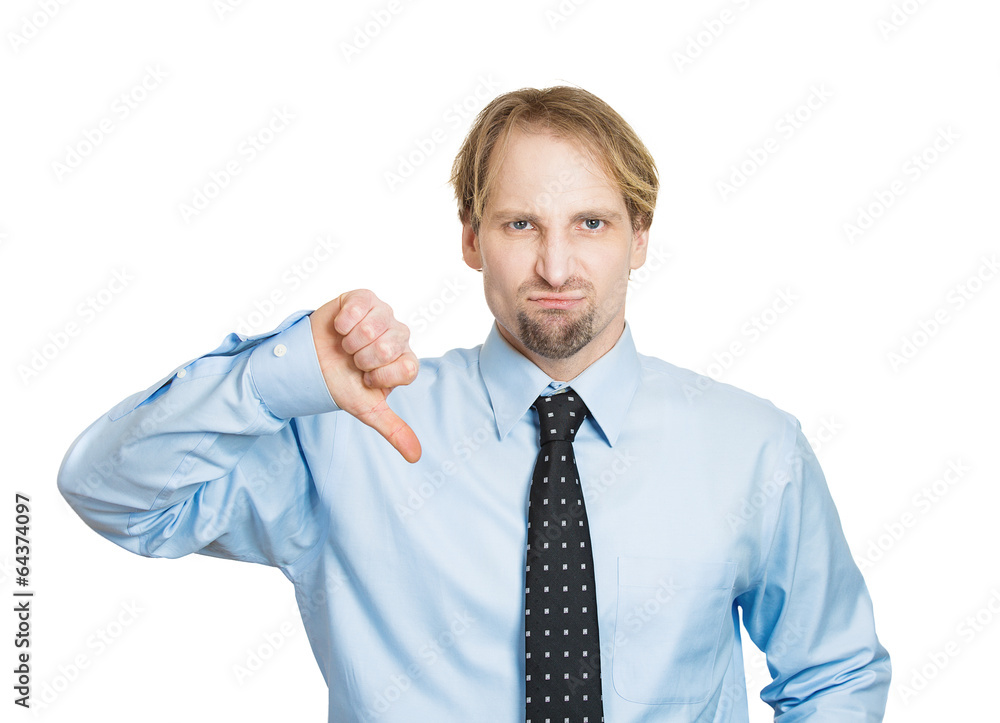 Businessman giving thumbs down unhappy displeased with situation Businessman giving thumbs down unhappy displeased with situation