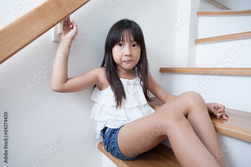 Girl sitting in on the ladder