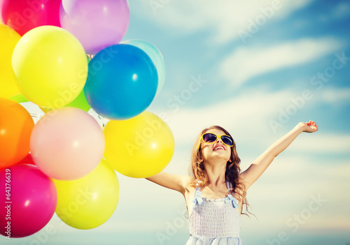 happy girl with colorful balloons © Syda Productions