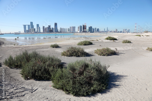 Abu Dhabi skyline as seen from Saadiyat Island photo