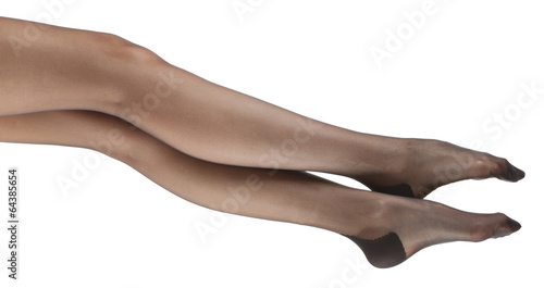 Stockings on perfect woman legs  isolated on white