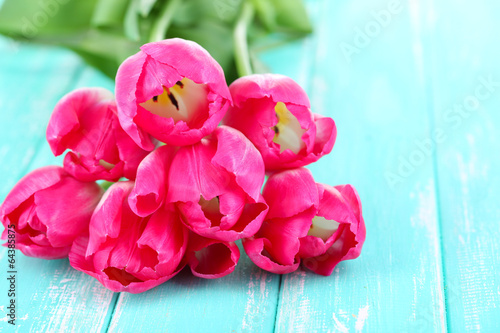 Fototapeta Naklejka Na Ścianę i Meble -  Beautiful tulips on color wooden background