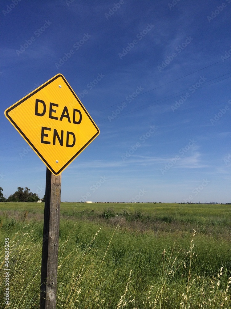 dead end sign and blue sky