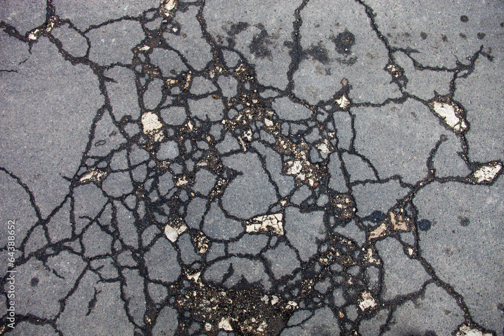 Obraz premium Cracked asphalt surface