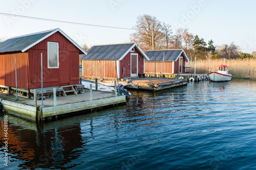 Valokuvatapetti Three boathouses