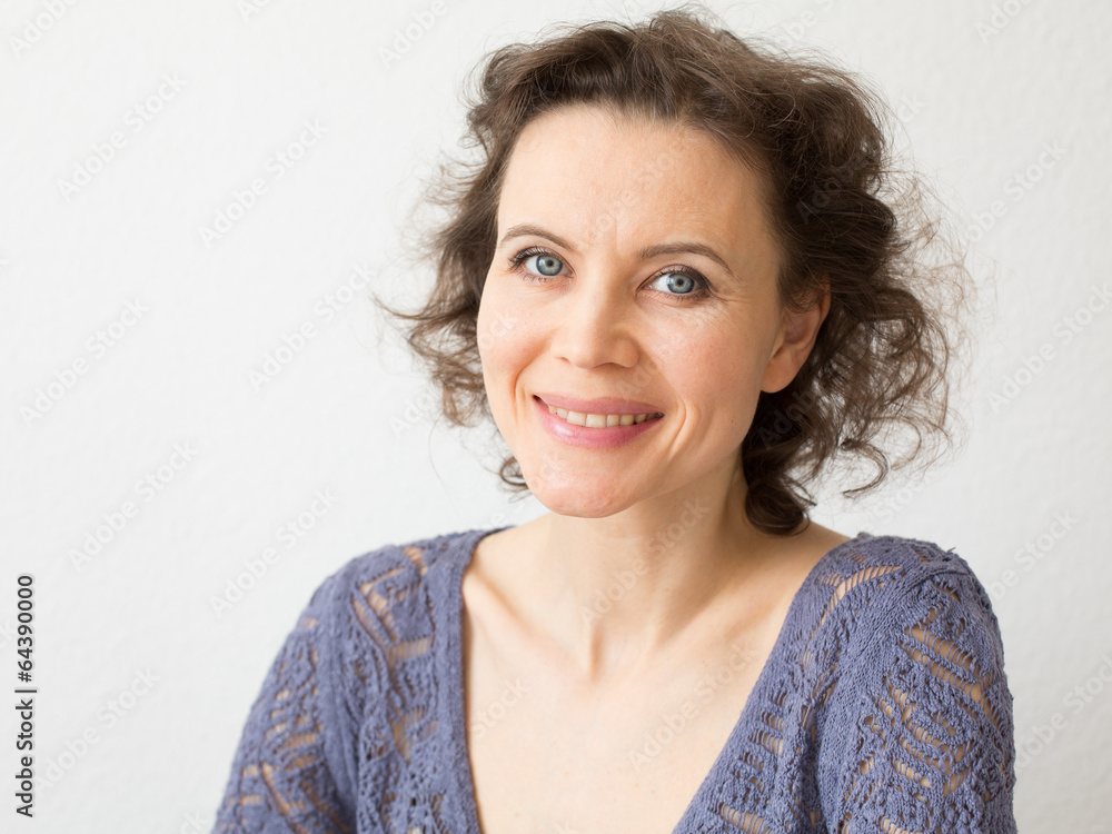 Romantic woman looking into camera with smile Romantic woman looking into camera with smile