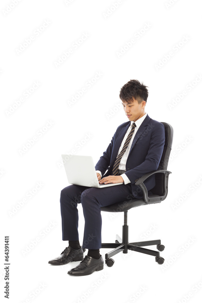 businessman using laptop on the chair businessman using laptop on the chair