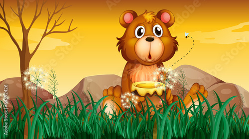 A cute bear holding a pot of honey