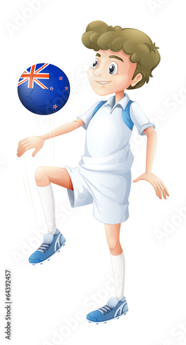 A boy using the ball designed with the flag of New Zealand