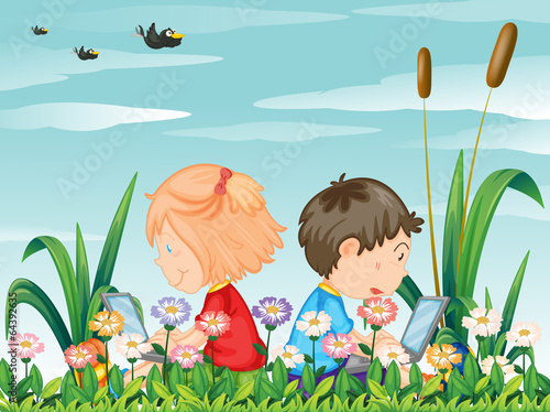 Kids at the garden with their laptops