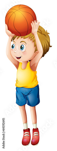 A cute boy playing basketball