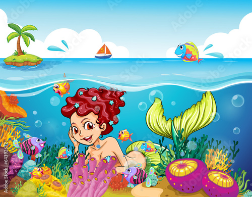 A smiling mermaid under the sea