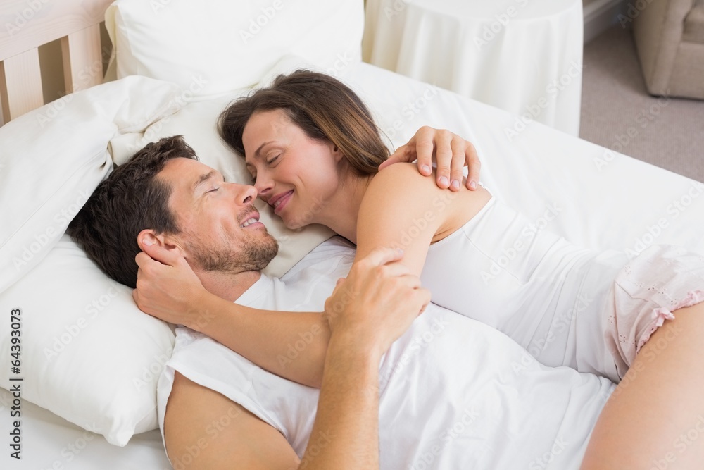 Relaxed couple sleeping together in bed Relaxed couple sleeping together in bed