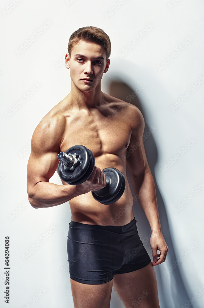Young bodybuilder man exercising