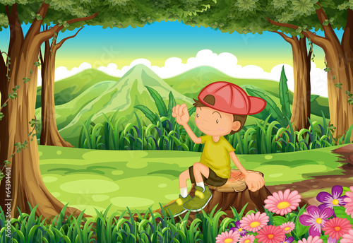 A young boy at the forest sitting above the stump