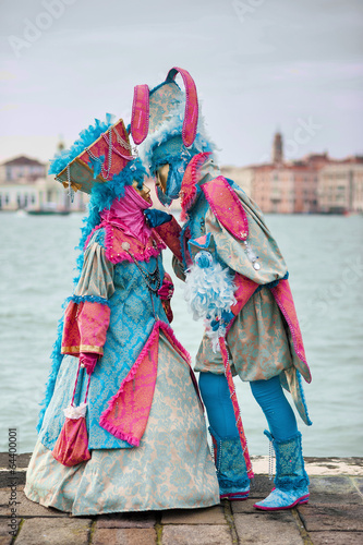 Carnival of Venice, beautiful masks kissing at St. George island