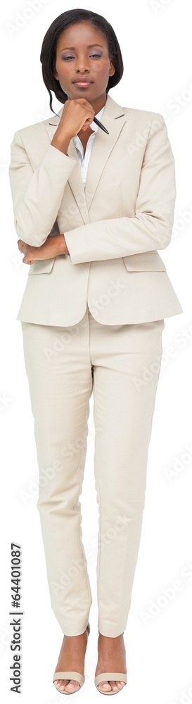Thinking businesswoman in cream suit Thinking businesswoman in cream suit