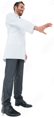 Handsome young doctor gesturing with hand