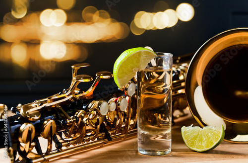 Photography saxophone and tequila with lime