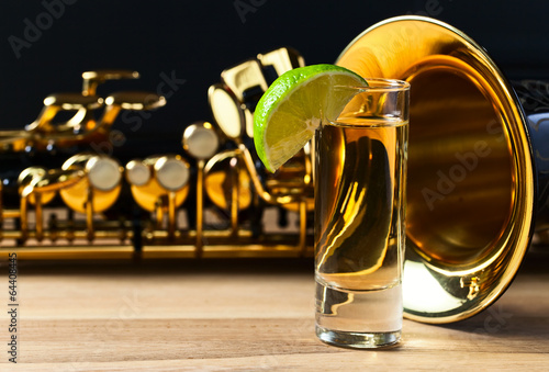 Photography saxophone and tequila with lime