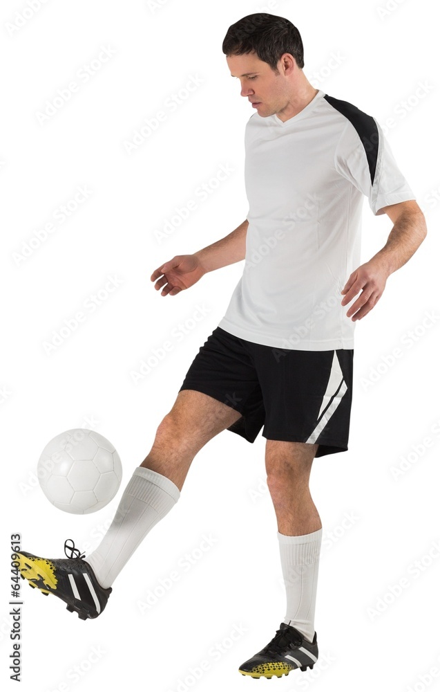 Football player in white kicking Football player in white kicking