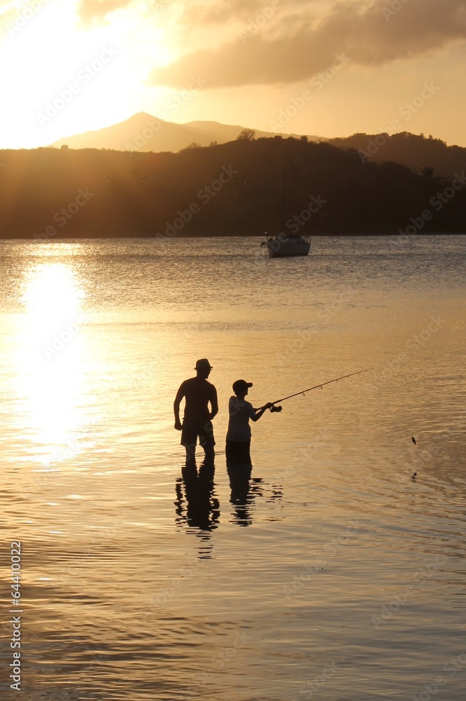 fishing sunset father son family fathers day coral coronavirus lockdown quarantine concept silhouette casting rod line teach learn parent stock photo, stock photograph, image, picture