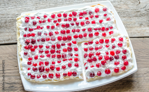 Tart with whipped cream and fresh cranberries